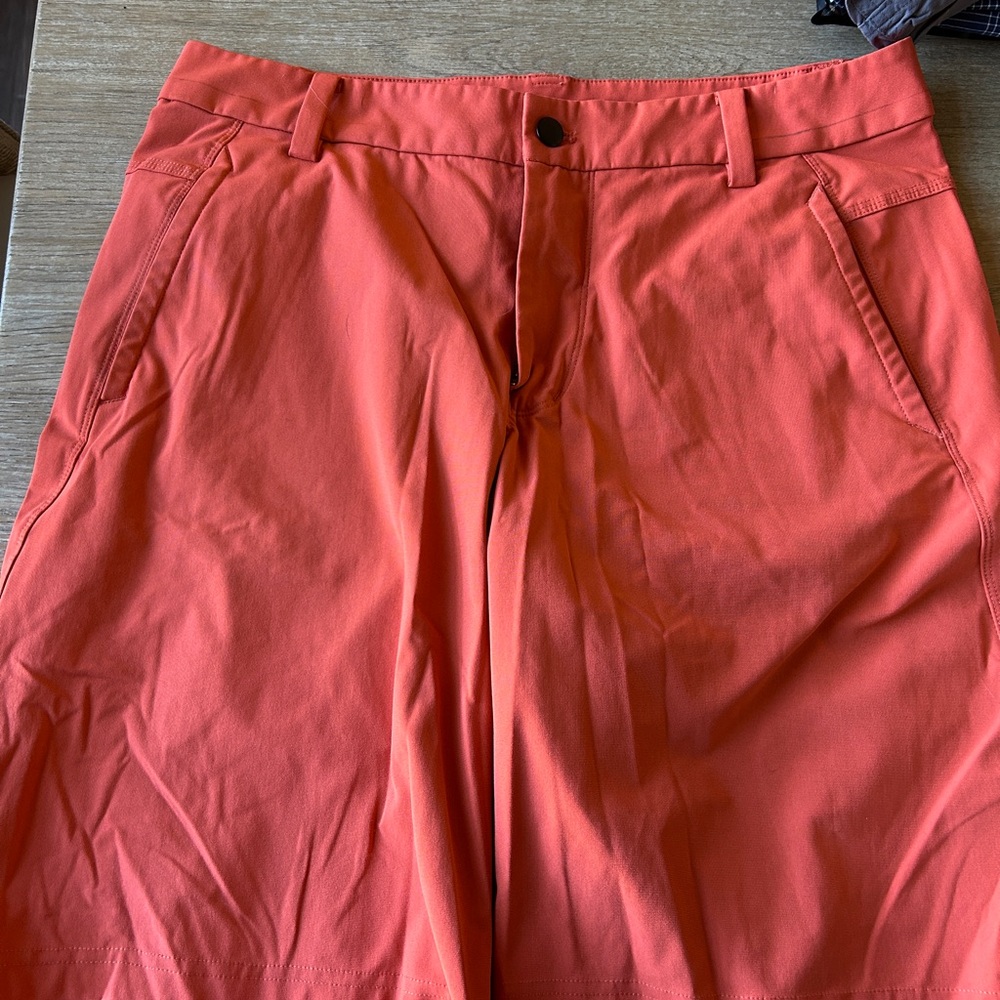 lululemon athletica Men’s Flat Front Shorts in Orange